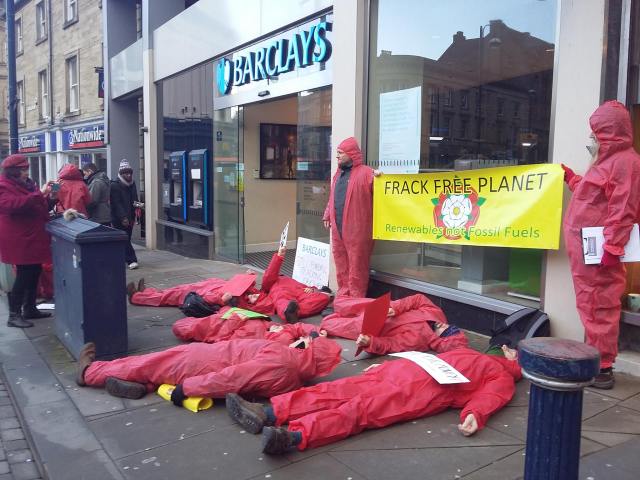 Red lines die in outside Barclays Huddersfield opposing the banks Yorkshire fracking links